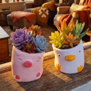 Set de mini macetas de cerámica con diseño de cerdito y patito, perfecta para suculentas y tunitas. Con drenaje, resistente y súper decorativa.